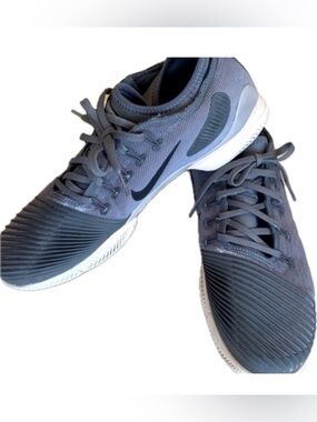 NIKE grey sneakers, breathable mesh, cool rubber trim on front, swoosh. 9.5